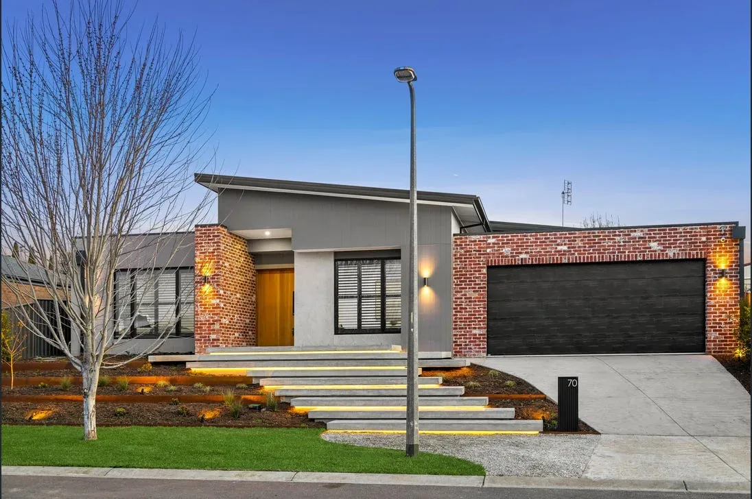 New concrete driveway poured with a fall toward the street
