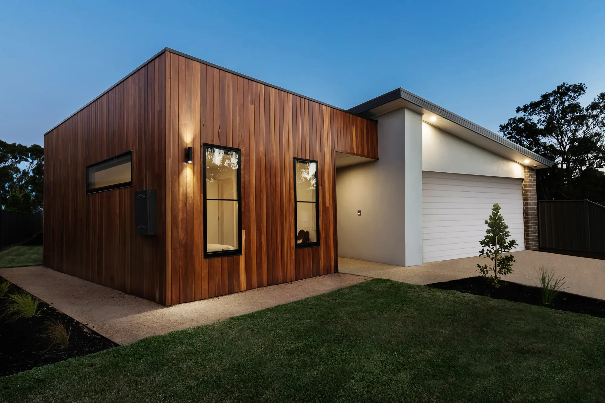 Concrete footpath leading around a home
