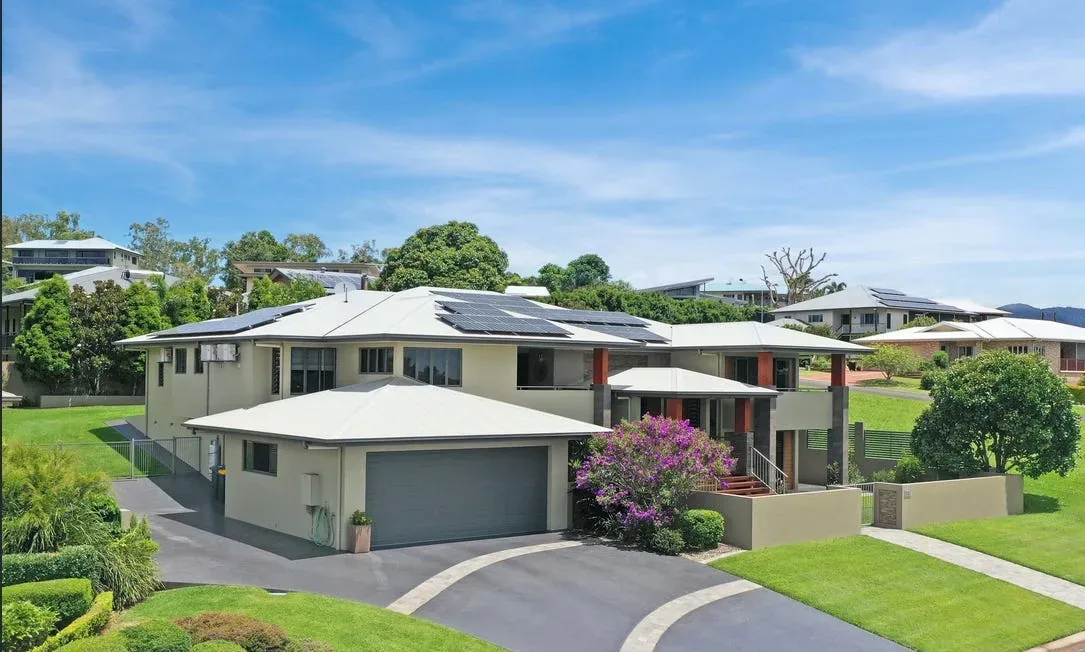 Curved concrete driveway around a family home