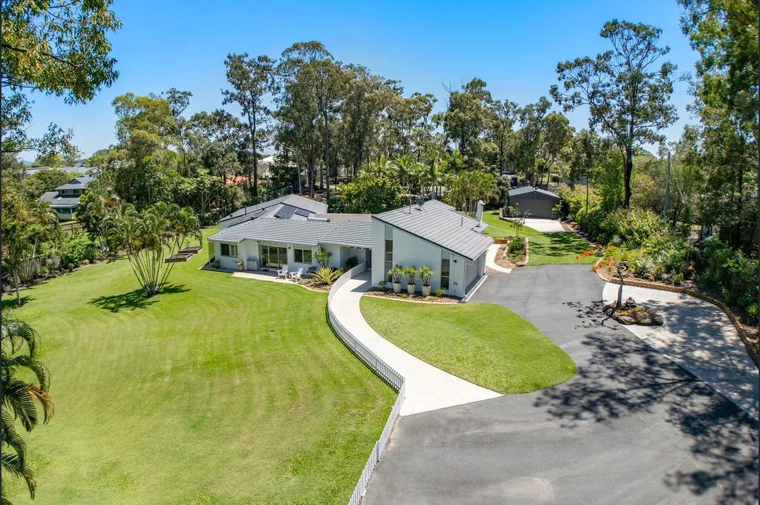 Concrete driveway leading to a modern Melbourne home